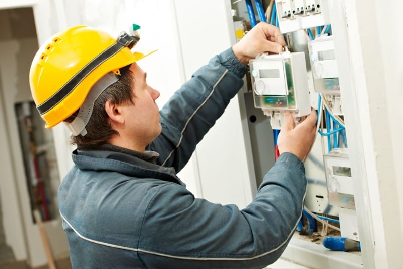 A technician on a smart meter installation